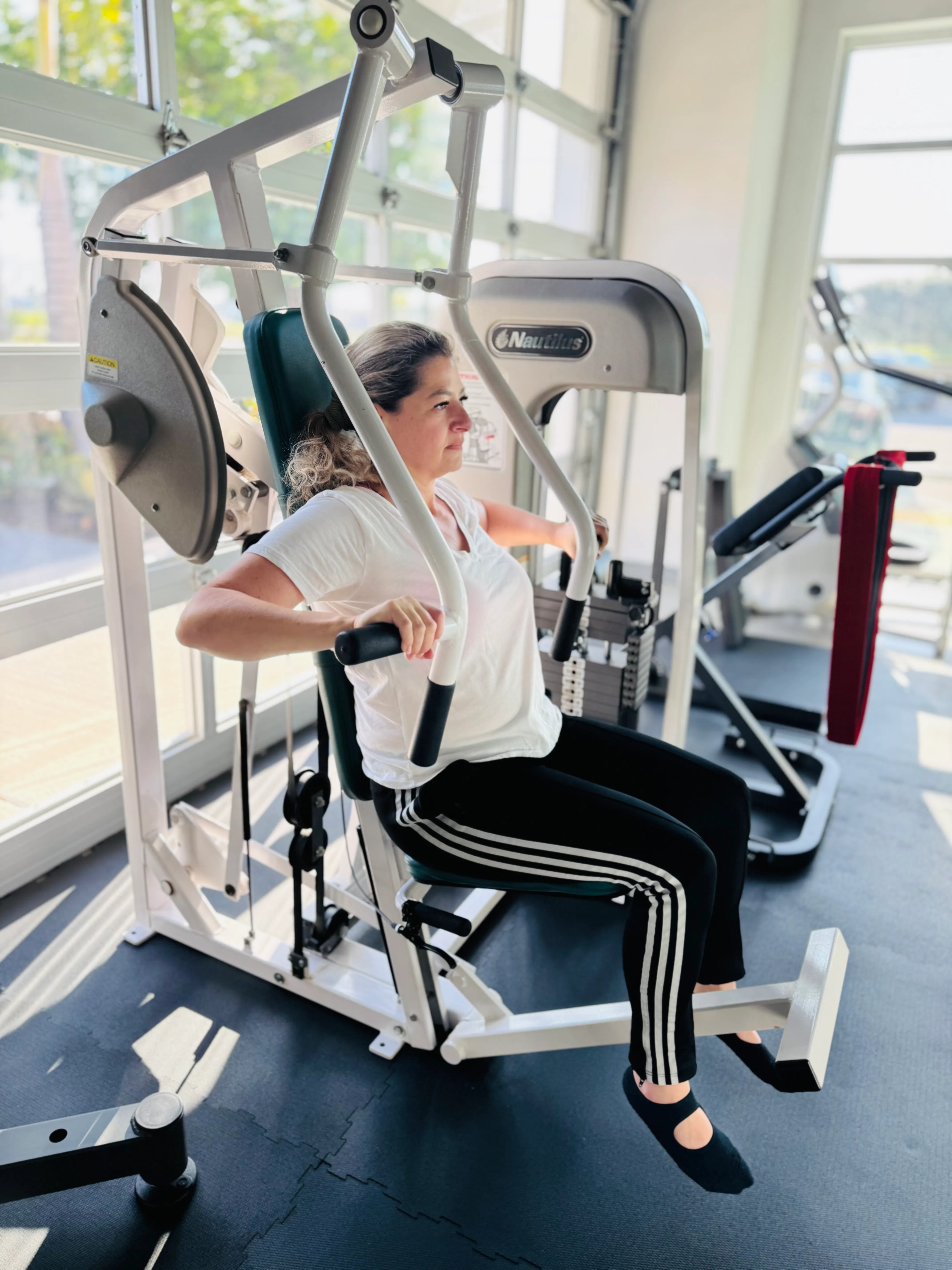 Woman working out with a trainer at Theorem